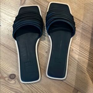 Black Sandals with Textured Straps and Flat Soles